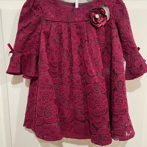 Elegant Burgundy Lace Dress with Floral Accent